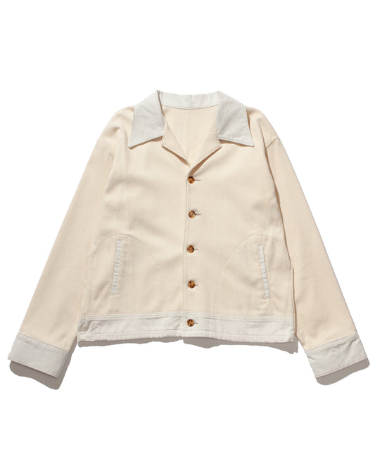 Classic fit corduroy durango jacket with dropped shoulders. Beige / Tan  / White colorway Convertible collar with center front button closure. Front welt hip pockets and button cuff closure. made in usa, Front view